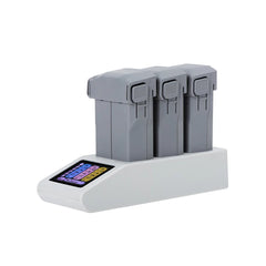 Three DJI Mini 5 Pro batteries inserted into the STARTRC sequential charging hub.