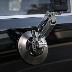 AeroFocus action camera shock absorber mount attached to a smooth vehicle body surface