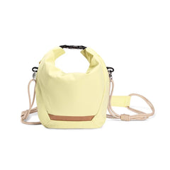 Vibrant Yellow AeroFocus Cloud Roll series expandable camera bag for outdoor travel and street photography.