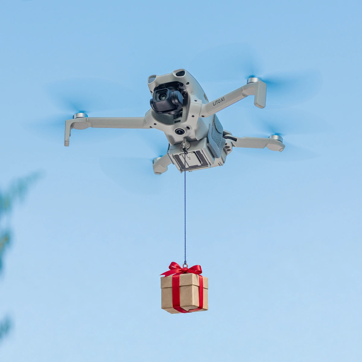 AeroFocus air dropping system mounted on a compatible DJI Mini or Lito drone for a controlled lightweight payload release demonstration