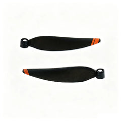 Two DJI Mini 2 propeller blades showing black and orange design