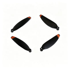 Four DJI Mini 2 propeller blades laid out for display