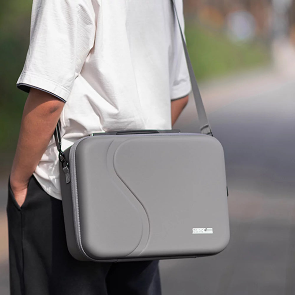 User demonstrating the crossbody carrying style for DJI Neo 2 Motion Combo.