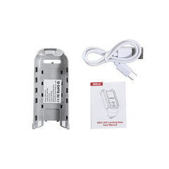 Package contents of DJI Neo night flight kit including landing gear, cable, and manual.