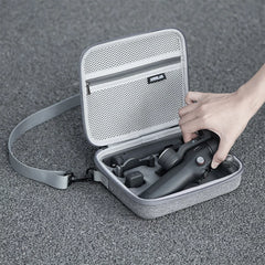 Handheld display of the lightweight DJI OM 8 nylon storage bag.