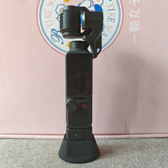 DJI Pocket 4 mounted on a metal surface using the magnetic base for creative vlogging.