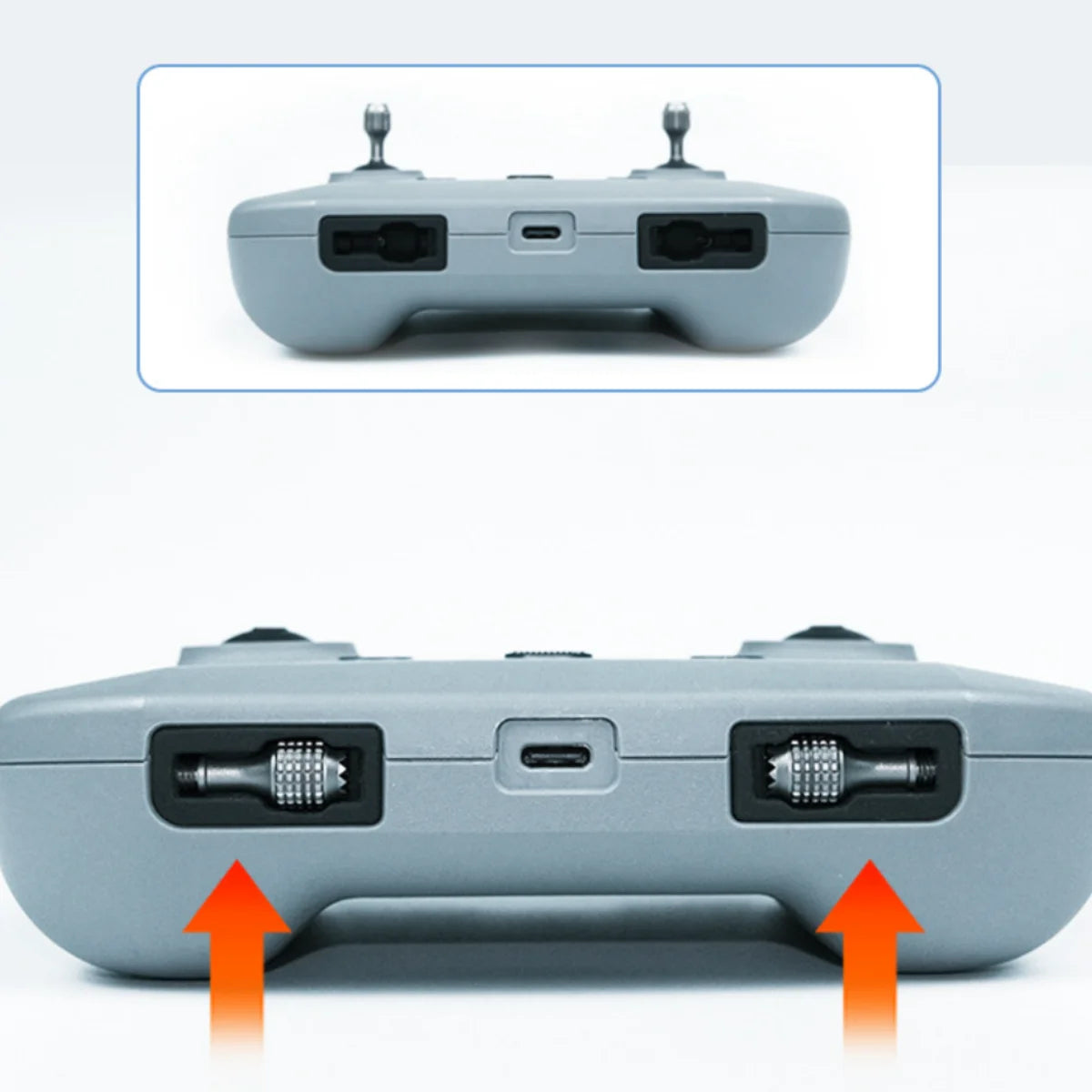 DJI RC-N2 remote controller with aluminum sticks stored in the original handle slots.