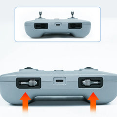 DJI RC-N2 remote controller with aluminum sticks stored in the original handle slots.