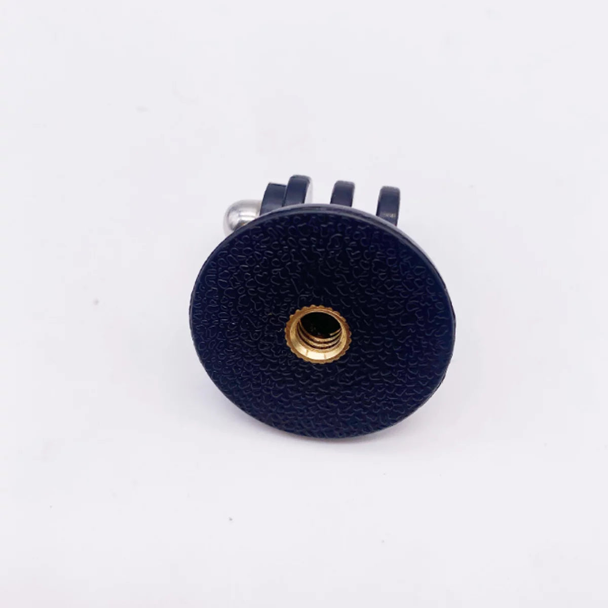Bottom view of the camera mount adapter showing the standard 1/4 inch screw hole.