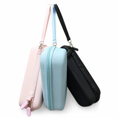 Pink light blue and black Insta360 Luna Ultra EVA cases shown in hand