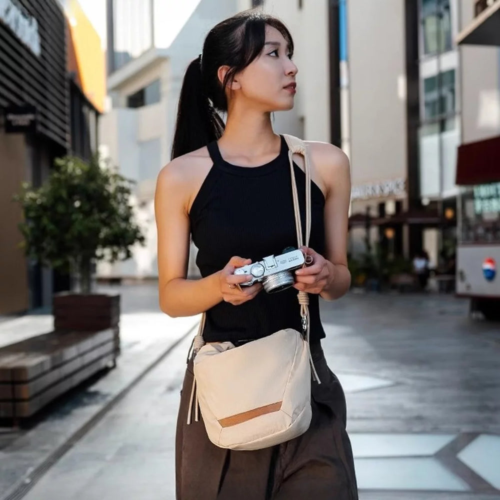 Ultra-lightweight cloud-style camera sling bag for travel photography.