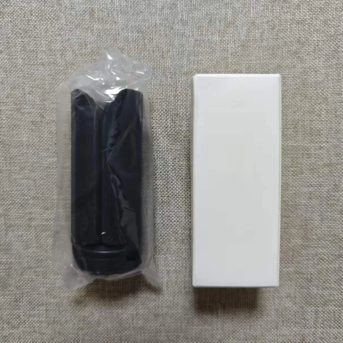 Package contents of the DJI Pocket 3 mini tripod including the white box.