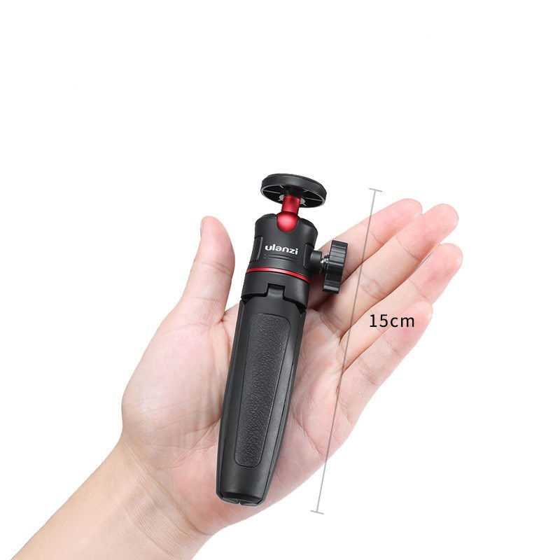 Smartphone mounted on mini tripod for live streaming and video recording