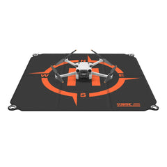 STARTRC 55cm foldable landing pad with a consumer drone positioned for takeoff