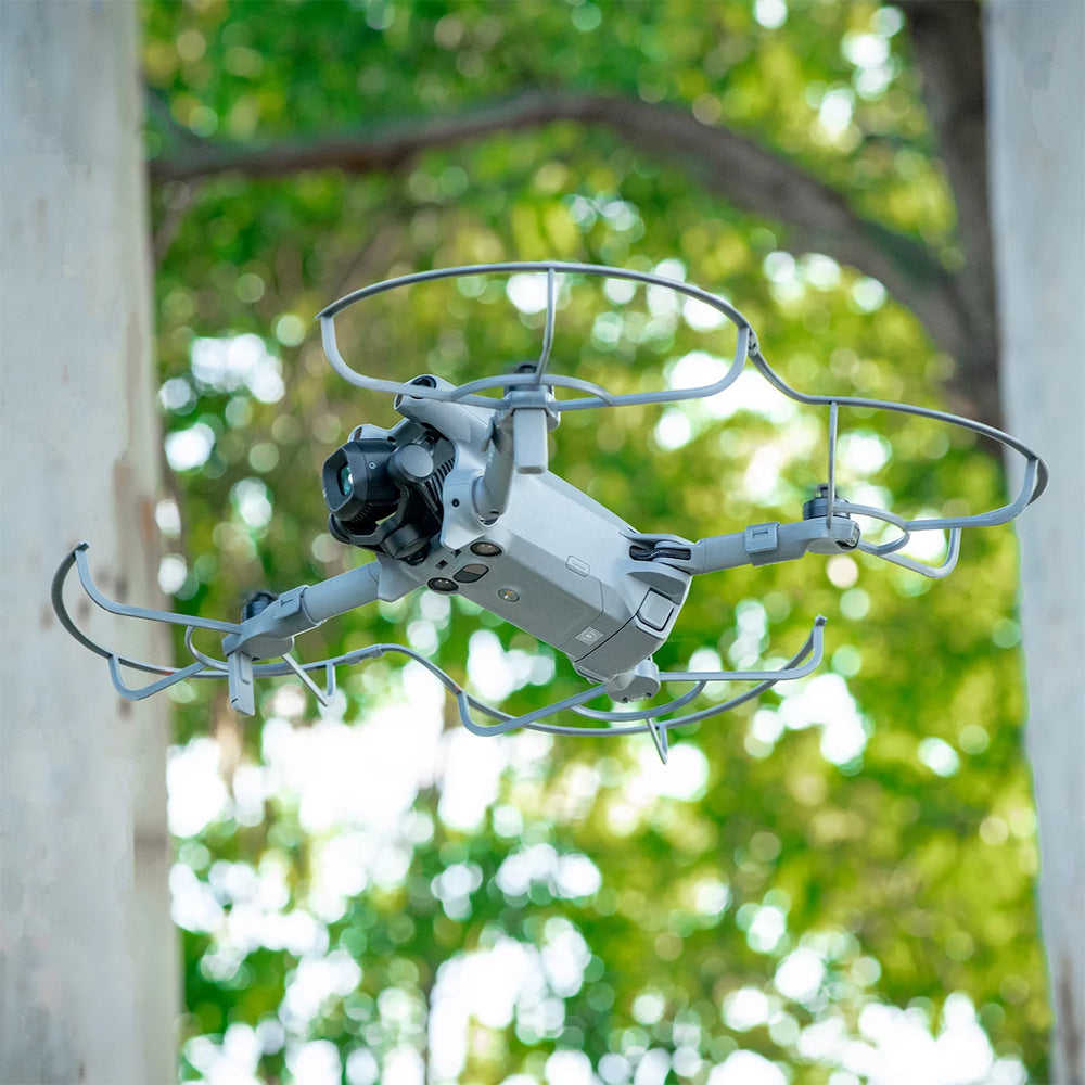 DJI Mini 5 Pro flying safely indoors with STARTRC propeller protectors.